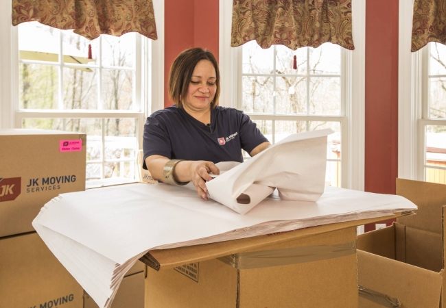 A JK Moving professional wrapping china