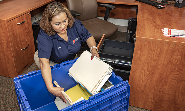 A JK Moving team member providing office moving services