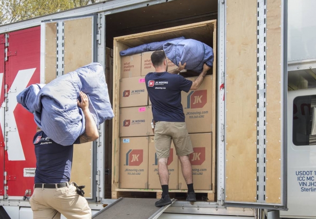 JK Moving professionals load a moving truck