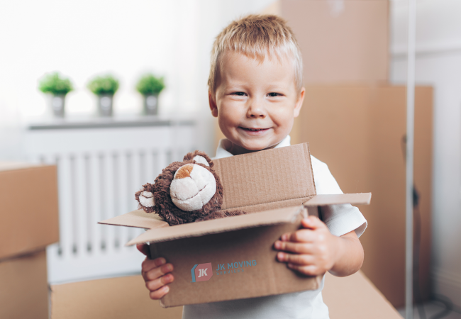 Kids carefully packing a toy