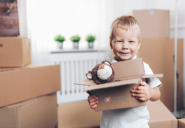 Kids carefully packing a toy