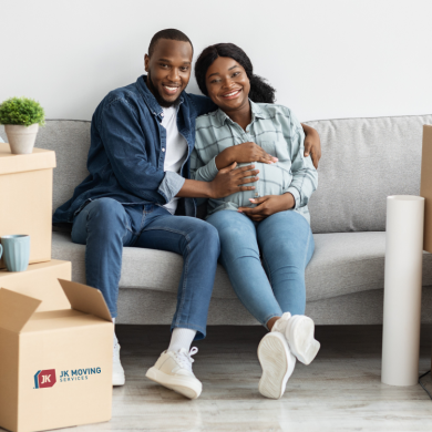Young pregnant couple moving to new home