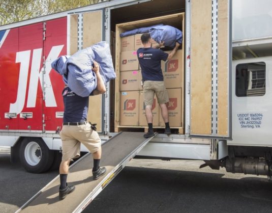 JK Moving professionals load a moving truck