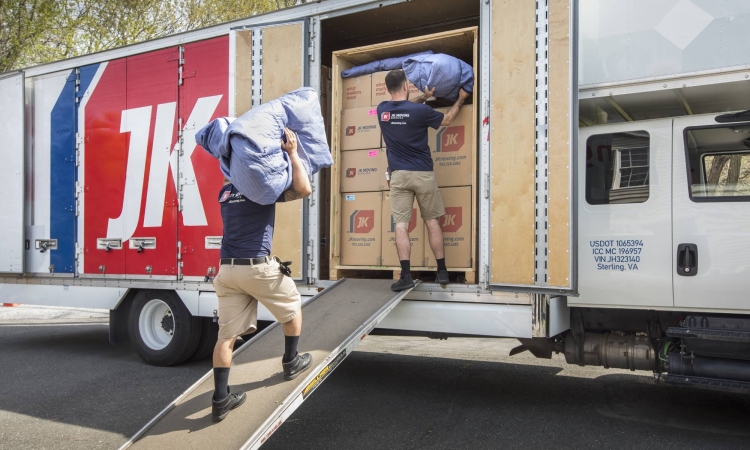 JK Moving professionals load a moving truck