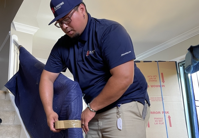 Mover prepping banister for home move