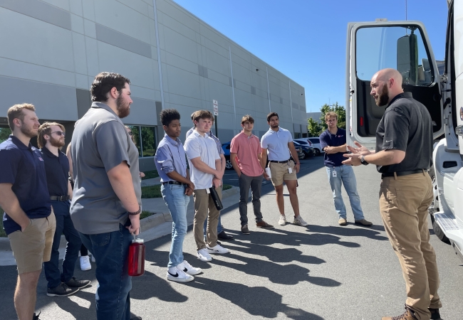 Summer interns learning about JK trucks