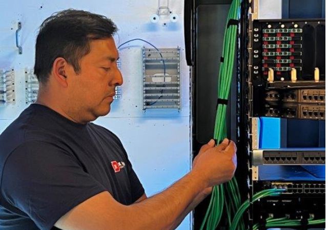 JK Moving employee participating in an cable abatement process