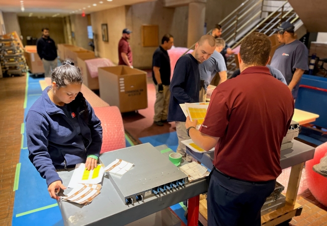 Group of people preparing detailed inventory and valuation prior to an office decommissioning project