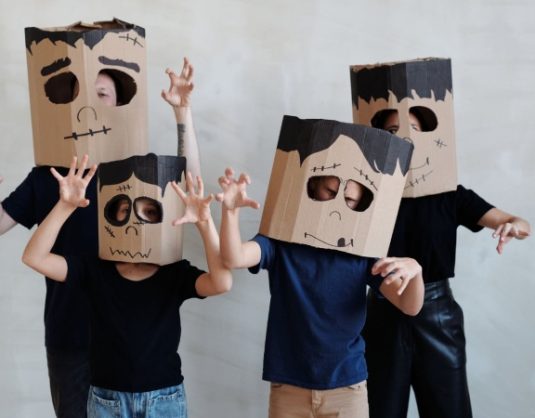 Cardboard boxes transform into fantastical Halloween costumes, showcasing adults and kids' creativity and imagination. DIY robots, castles, and more come to life with paint, glitter, and a sprinkle of fun.