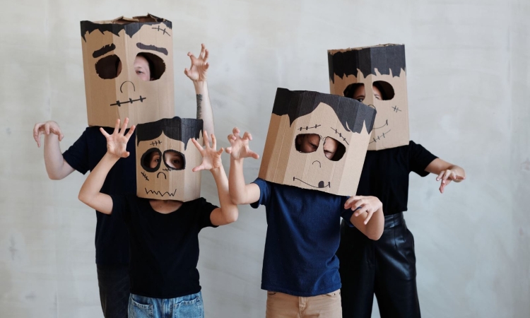 Cardboard boxes transform into fantastical Halloween costumes, showcasing adults and kids' creativity and imagination. DIY robots, castles, and more come to life with paint, glitter, and a sprinkle of fun.