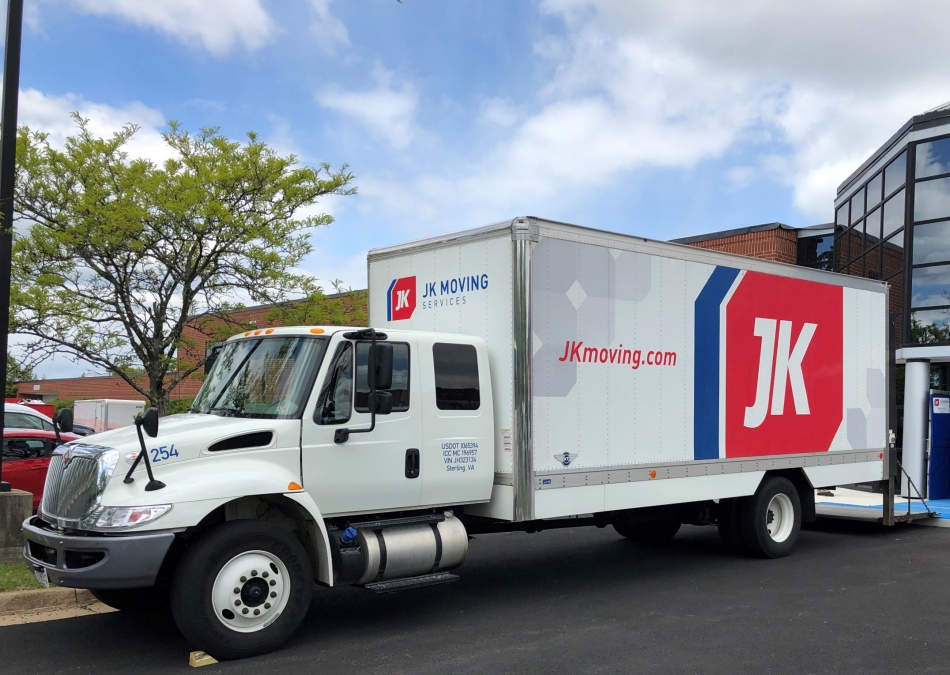 JK Moving commercial truck at office building