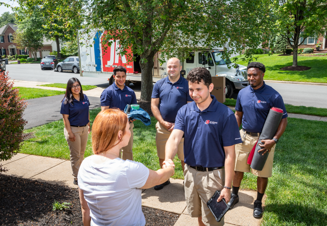 JK Moving moving crew meeting customer