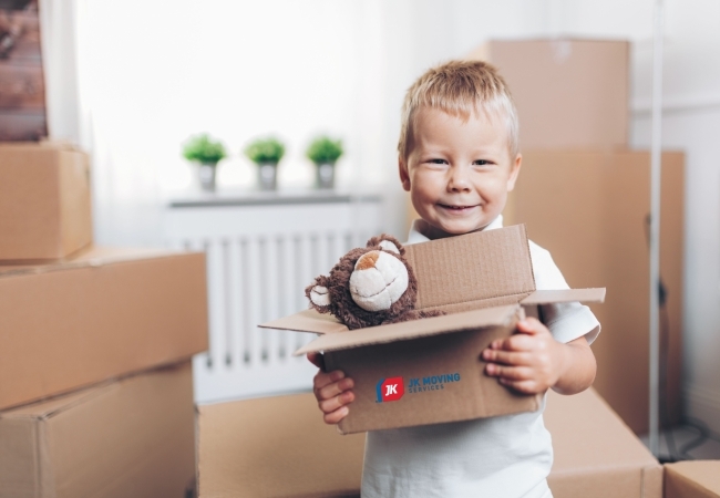 Little boy packing bear