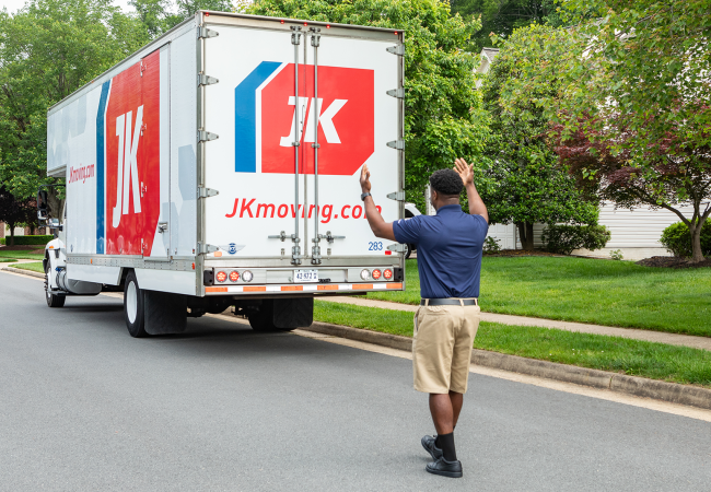 JK Moving truck backing up