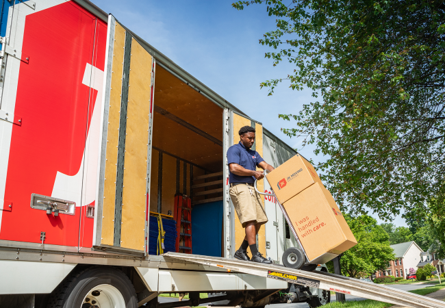 JK Moving Maryland crew member unloading truck