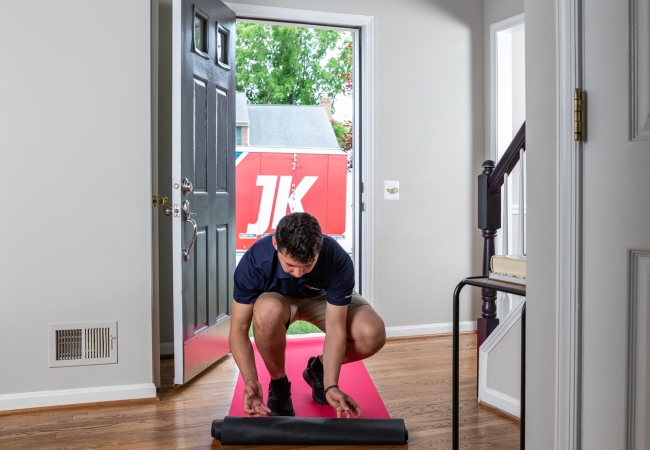 JK moving crew member protecting floor