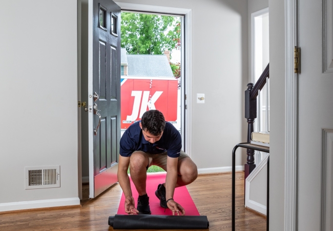 JK moving crew member protecting floor