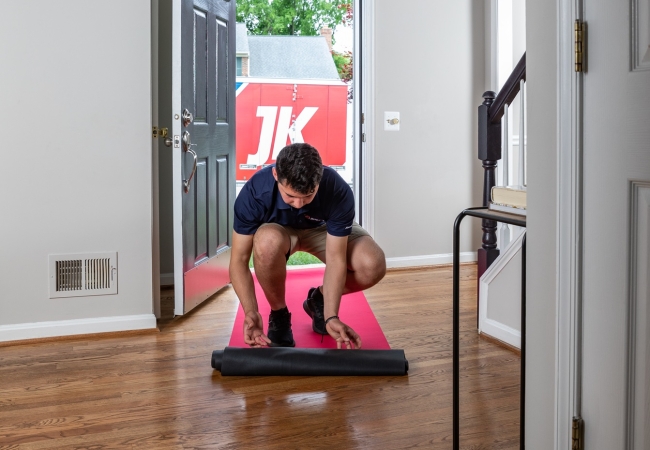JK moving crew member protecting floor