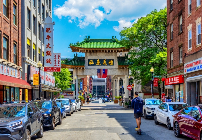 The China Trade Gate is a paifang archway at the Beach Street entrance to the Chinatown neighborhood of Boston, Massachusetts, United States. It was designed by David Judelson and was originally donated to the city by the government of Taiwan in 1982. Hanging from the gate, are the national flags of the United States and Taiwan (ROC). The four Chinese characters on the gate translate to "A World Shared By All".