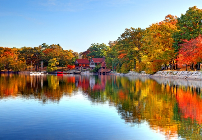 Autumn foliage reflection on Jamaica Pond in Boston's Jamaica Plain neighborhood. Boston is the largest city in New England, the capital of the state of Massachusetts. Boston is known for its central role in American history,world-class educational institutions, cultural facilities, and champion sports franchises.