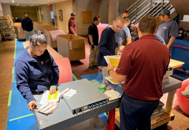 Group of people preparing detailed inventory and valuation prior to an office decommissioning project