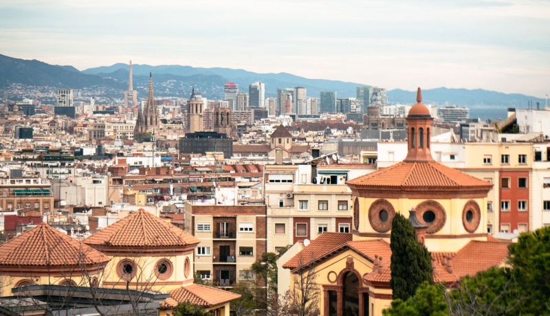 Barcelona skyline and rooftops along the Mediterranean coast.