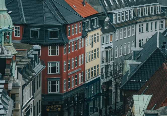 Colorful historic buildings along a narrow street in Copenhagen, Denmark