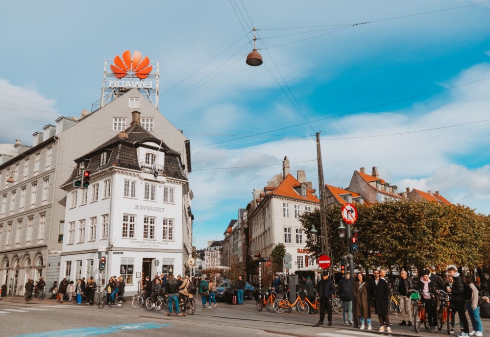 Cyclists and pedestrians on a busy street in Copenhagen, Denmark